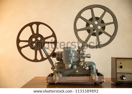 Retro old rusty projector of Cinema on table retro , the object is attach file with clipping path for easy to dicut to design some element in vintage concept, The old fashion and antique background.