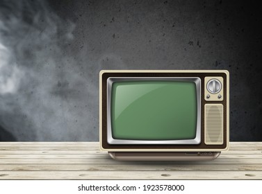 Retro Old TV Standing In A Dark Room On Wooden Desk