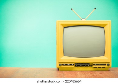 Retro Old Yellow TV Front Turquoise Wall Background