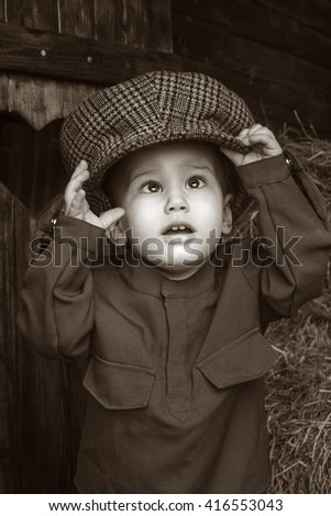 Similar – stylish little gentleman in hat looking up