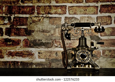 Retro Phone - Vintage Telephone On Old Desk With Brick Wall