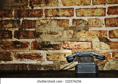 Retro Phone - Vintage Telephone On Old Desk With Brick Wall