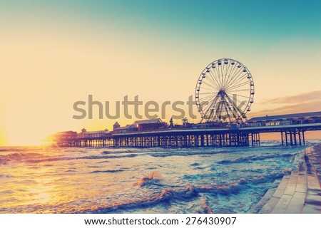 RETRO PHOTO FILTER EFFECT:  Blackpool Central Pier at Sunset with Ferris Wheel, Lancashire, England UK