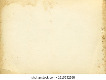 Retro photo paper texture. Old antique paper texture. Vintage paper background. Aged and yellowed postcard.