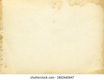 Retro photo paper texture. Old antique paper texture. Vintage paper background. Aged and yellowed postcard.