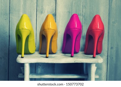 Retro photo of pink, yellow and red shoes