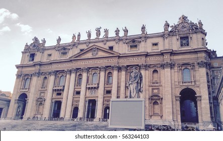Retro photo of St. Peter Basilica front entrance with statues, Vatican Rome