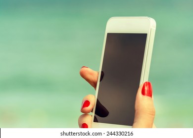 Retro Photo Of Young Girl Hand Holding Mobile Phone Similar To IPhone