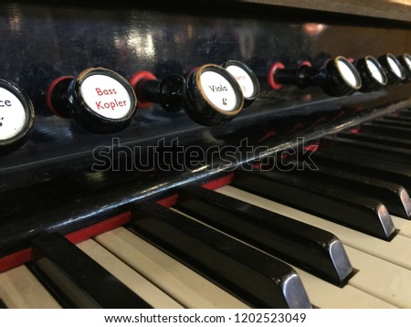 Retro piano musical instrument, piano key close up.
