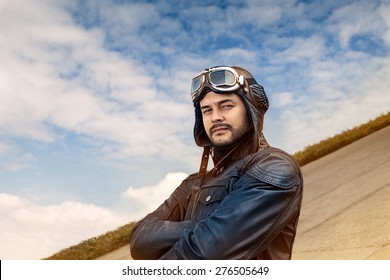 Retro Pilot Portrait With Glasses And Vintage Helmet - Image Of A Handsome And Confident Aviator Man  