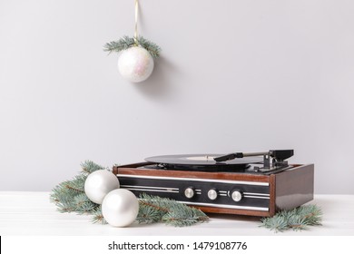 Retro player with Christmas decor on white background