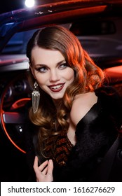 Retro Portrait Of A Beautiful Luxury Gatsby Woman In Black Convertible Car. Vogue Fashion Style And Smoke. Hollywood Look. Copy Space