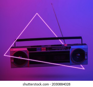 Retro radio tape recorder. in blue-red neon gradient light with triangle. Pop culture. 3D photo. 80s retro wave. Minimalism - Shutterstock ID 2030884028