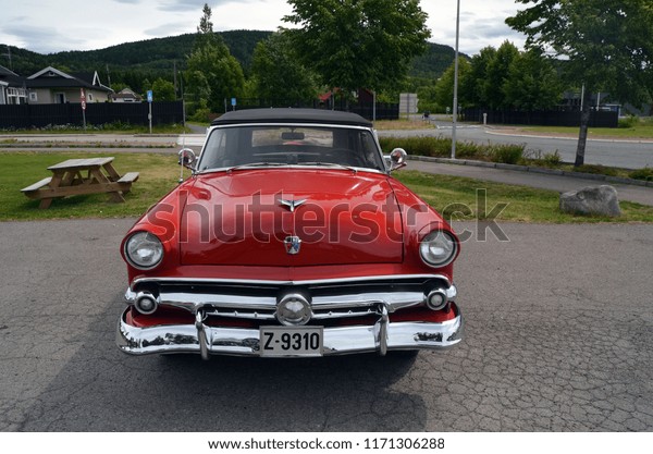 Retro red car  at the street. June\
21,2018. Kongsberg,Norway