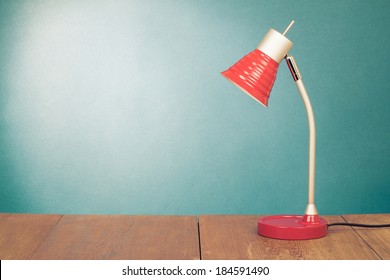 Retro Red Desk Lamp On Wooden Table