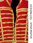 Retro Red Gold Hussar Uniform Close-Up Background. Imperial Guard Vintage Upper Dress Or Modern Masquerade Costume