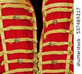 Retro Red Gold Hussar Uniform Close-Up Background. Imperial Guard Vintage Upper Dress Or Modern Masquerade Costume