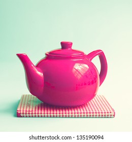Retro Red Teapot on Mint Background