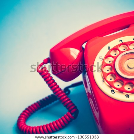Retro Red Telephone on Blue Background
