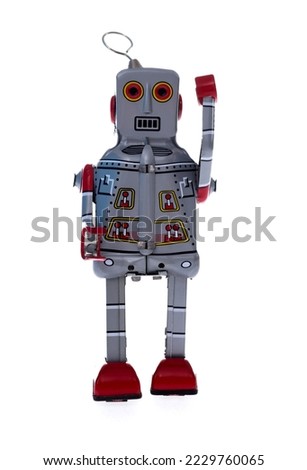 Retro robot toy on white background.
