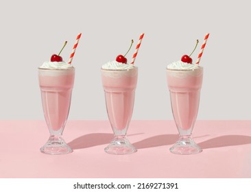 Retro romantic creative pattern with strawberry milkshake with cherry on top on white and pastel pink background. 70s, 80s or 90s retro fashion aesthetic idea. Valentines day romantic idea. - Shutterstock ID 2169271391