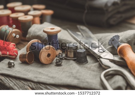 Similar – Image, Stock Photo Dressmaker cutting a cloth