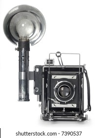 Retro Speedgraphic camera shot from the front on a white background