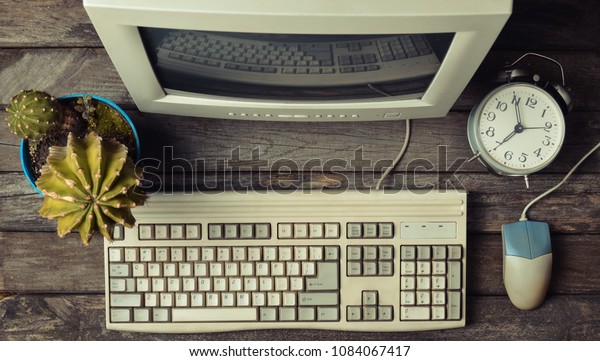 Retro Stationary Computer On Rustic Wooden Vintage Technology