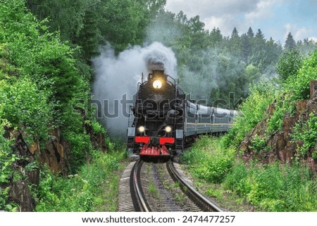 Retro steam train moves between the rocks.