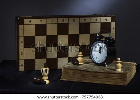 Retro still life with chess with mysterious lighting.