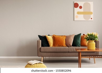 Retro style in beautiful living room interior with grey empty wall - Shutterstock ID 1550852096