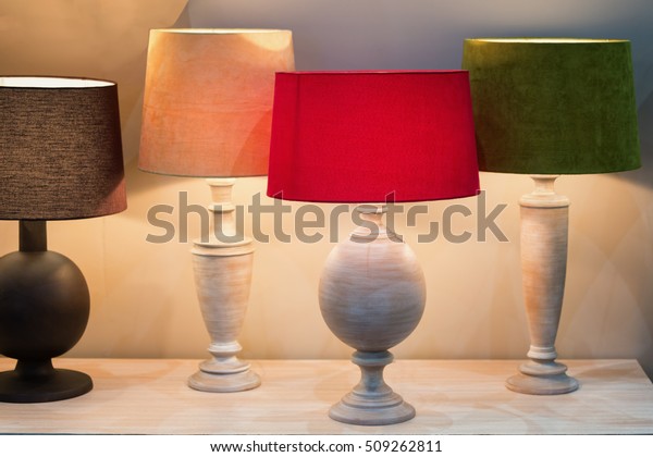 Retro style desk lamps with many lampshade\
colors decorated in\
bedroom.