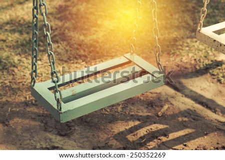 Retro style empty chain swing.