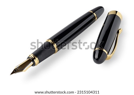 Retro style fountain pen, black with golden trim, isolated on white background