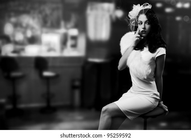 Retro Style Image. Smoking Lady In The Bar