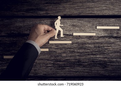 Retro style image of a successful businessman climbing the corporate ladder using paper cutouts.