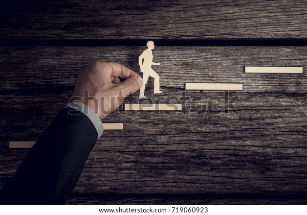 Retro style image of a\
successful businessman climbing the corporate ladder using paper\
cutouts.