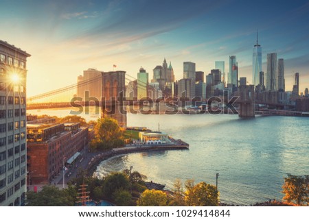 Retro style New York Manhattan with Brooklyn Bridge and Brooklyn Bridge Park in the front.