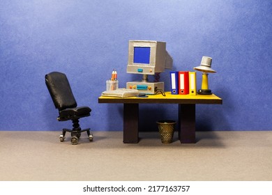 Retro Style Office Workplace. Vintage Toy Computer, Empty Blue Screen Monitor, Pc Mouse Keyboard, Archive Files. Desk Lamp. Comfortable Black Leather Manager Chair.