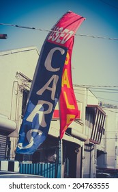 Retro Style Photo Of A Sale Sign At A Used Car Dealer