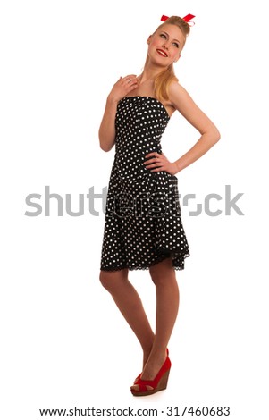 Retro style pin up girl with blonde hair in black dress wtih white dots isolated over white background