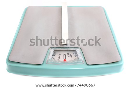 Retro style weighing machine isolated on a white background.