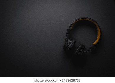 Retro style wireless over-ear headphones on dark gray background - Powered by Shutterstock