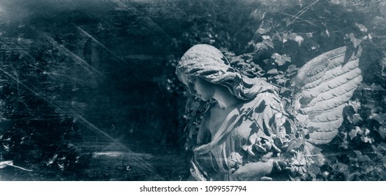 Retro Styled Ancient Statue Of Sad Angel With Wings Against Dark Background 