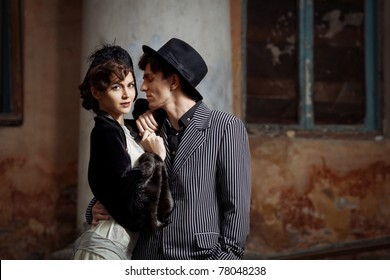 Retro Styled Fashion Portrait Of A Young Couple. Clothing And Make-up In 1920s Style.