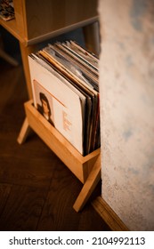 Retro styled image of boxes with vinyl turntable records in the room or storage. Vertical view