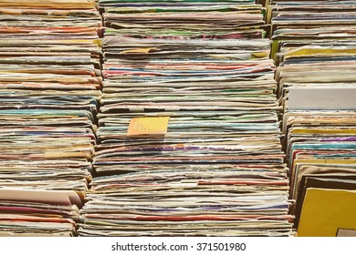 Retro styled image of boxes with vinyl turntable records on a flee market