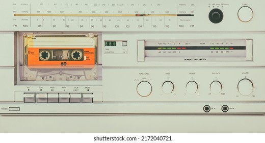 Retro styled image of a vintage silver audio system with cassette player, radio and amplifier