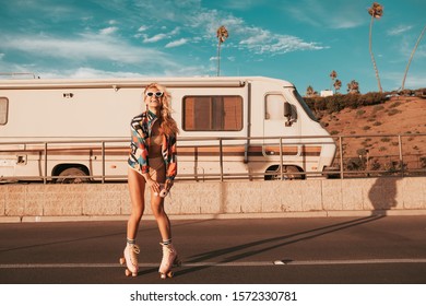 retro styled skater girl with a camper van in the background - Powered by Shutterstock