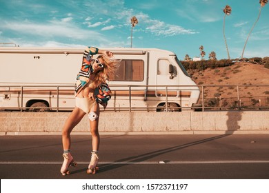 retro styled skater girl with a camper van in the background